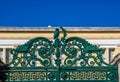 Iron fence with ornaments including an owl around the uilding of the National & Kapodistrian University of Athens in