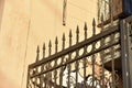 Iron fence with pins and lanterns in the city Royalty Free Stock Photo