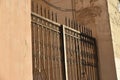 Iron fence with pins and lanterns in the city Royalty Free Stock Photo