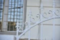 Iron fence with pins and lanterns in the city Royalty Free Stock Photo