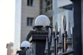 Iron fence with pins and lanterns in the city Royalty Free Stock Photo