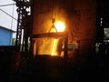 iron flowing in steelworks. Industrial details of metallurgic factory or plant. Details of smelting metal