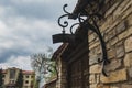 Iron forged street lamp hanging on a stone wall Royalty Free Stock Photo