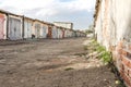 Iron garage door on an empty street in the industrial area Royalty Free Stock Photo