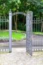 Iron gate in the fence entrance to the courtyard.