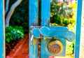 Iron gate with an old brass lock