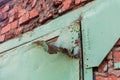 Iron gate old and rusty brick building close up Royalty Free Stock Photo