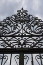 Iron gate silhouette. Cloudy sky