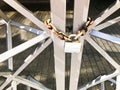 Iron gates, metal bar fence frozen on a strong old rusty chain of links on a granary large lock. The background Royalty Free Stock Photo