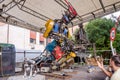 Iron Giant robot musician, collected from large pieces of metal from the dump, plays guitar, managing your computer, on the stage