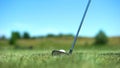 Iron golf club hitting white ball on course, professional sport, elite hobby Royalty Free Stock Photo