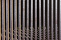 Iron grate over the drainage channel on the road. Rusty texture and scuffs on the metal. Metal grilles on the drainage system