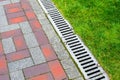 Iron grating line of the drainage system. Royalty Free Stock Photo