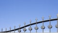 Iron grille of a house fence. ornamental artistic details and spearhead or arrowhead finish. security concept. copy space