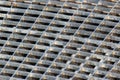 Iron gutter grates and metal vent grids as background