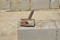 The iron hammer lies on a cinder block. Royalty Free Stock Photo