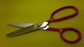 iron handle cloth scissors, cloth cutting scissors, yellow background Royalty Free Stock Photo