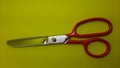 iron handle cloth scissors, cloth cutting scissors, yellow background Royalty Free Stock Photo