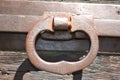 Close-up view of the iron handle of the lock of an ancient wooden door Royalty Free Stock Photo