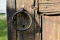 Iron handle ring on the old wooden gate in the Russian village, wood texture, background