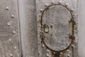 Iron hatch oval technical hole on background gray surface rivets weather-beaten rusty base industrial design