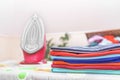 Iron and ironed clothes. Royalty Free Stock Photo