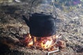 Iron kettle on the fire, life of the Eskimo of Alaska Royalty Free Stock Photo