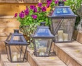 Iron lamps for candles and flowers petunias Royalty Free Stock Photo