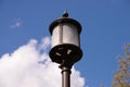 iron lantern for street ighting and against the blue sky Royalty Free Stock Photo
