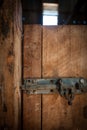 Iron latch lock on a wooden door Royalty Free Stock Photo