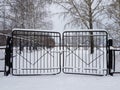 Snow-covered iron lattice gates Royalty Free Stock Photo