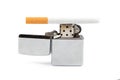 Iron lighter and cigarette on white Royalty Free Stock Photo