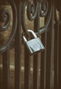 Iron lock on the black forged fence Royalty Free Stock Photo