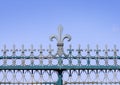 Iron made fleur de lis symbol on a fence