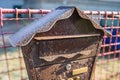 Iron mailbox buried in snow by covered road, mailbox covered with snow close up Royalty Free Stock Photo