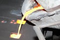 Iron molten metal pouring in sand mold Royalty Free Stock Photo