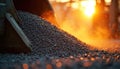 Iron ore pellets are piled high in an industrial processing facility. A close up view shows granular material on a sloped Royalty Free Stock Photo