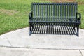 Iron Park Bench with Shadows Below It