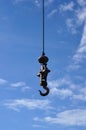 A iron pendulum hook with blue sky. Royalty Free Stock Photo