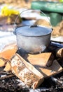 iron pot on fire wood Royalty Free Stock Photo