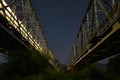 Iron railroad bridges at night