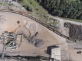 Iron raw materials recycling pile, work machines. Metal waste junkyard. View from above. Royalty Free Stock Photo