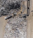 Iron raw materials recycling pile, work machines. Metal waste junkyard. View from above. Royalty Free Stock Photo