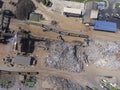 Iron raw materials recycling pile, work machines. Metal waste junkyard. View from above. Royalty Free Stock Photo