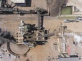 Iron raw materials recycling pile, work machines. Metal waste junkyard. View from above. Royalty Free Stock Photo