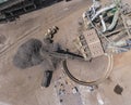 Iron raw materials recycling pile, work machines. Metal waste junkyard. View from above. Royalty Free Stock Photo