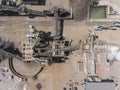 Iron raw materials recycling pile, work machines. Metal waste junkyard. View from above. Royalty Free Stock Photo