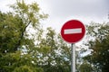 Iron red Do not enter blank sign closeup on blurred background of sky, trees Royalty Free Stock Photo