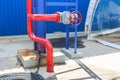 Iron red metal pipe with valve and flanges and drainage for emergency fire fighting at the factory. Fire crane Royalty Free Stock Photo