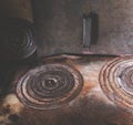 Iron circles on the old rural stove.